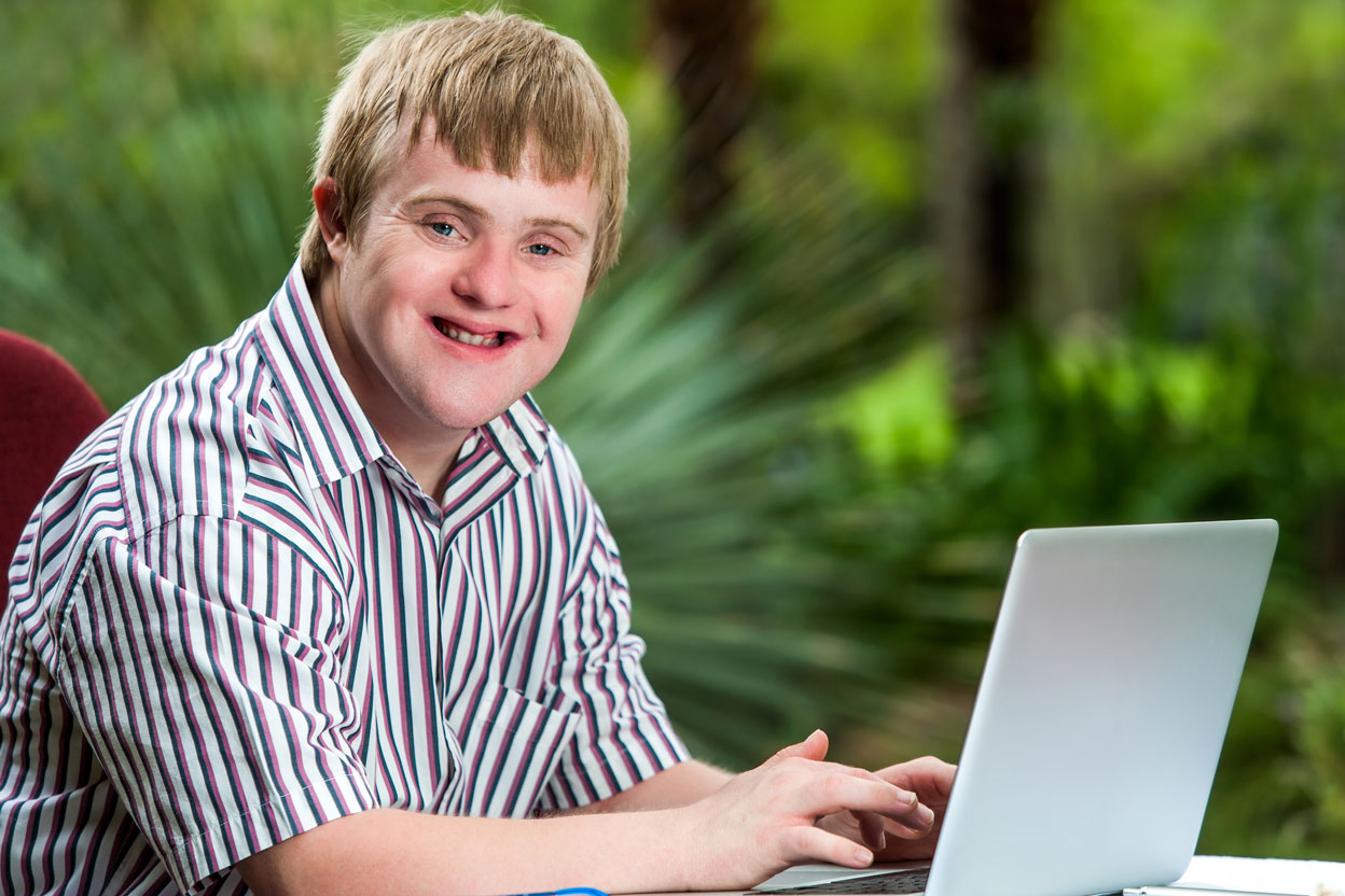 Young man works at his computer